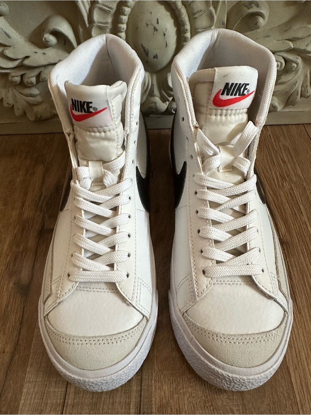 Nike White High-Top Sneakers with Black Swoosh